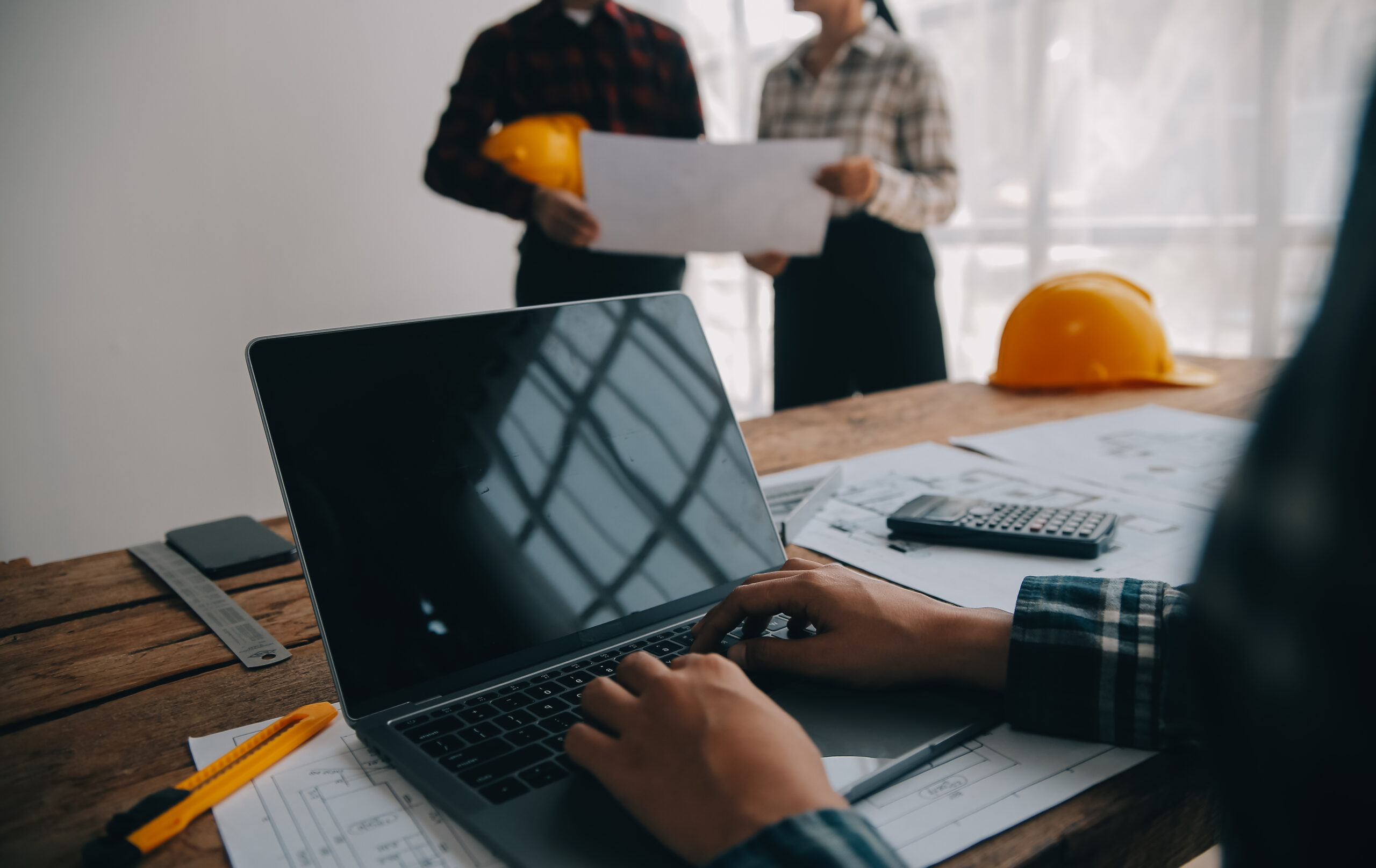 Two business man construction site engineer. Engineering objects Two business man construction site engineer. Engineering objects on workplace with partners interacting on background